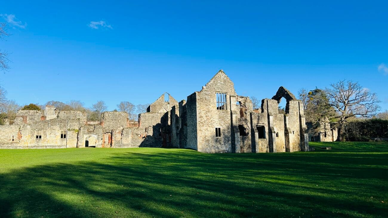 Netley Abbey stone arches under a blue sky
