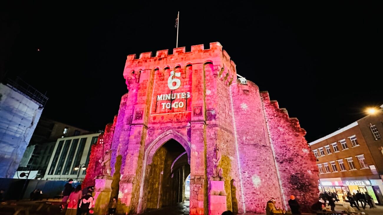 Night scene of The Bargate Southampton lit up against dark sky