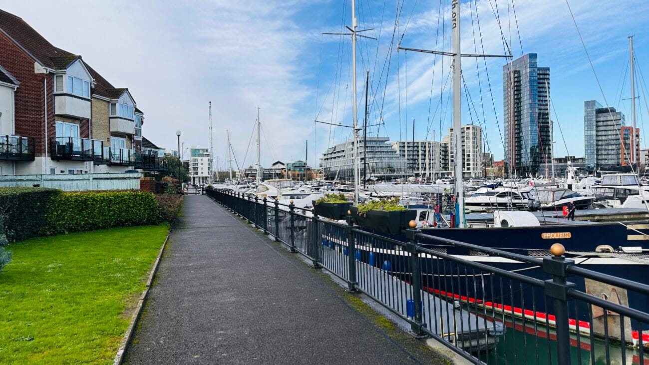 Ocean Village marina walkway beside moored yachts