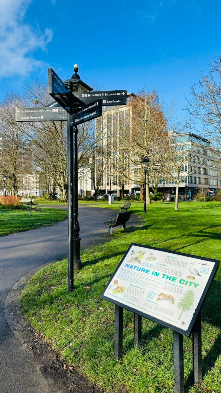 Pathway signpost in Watts Park with arrows
