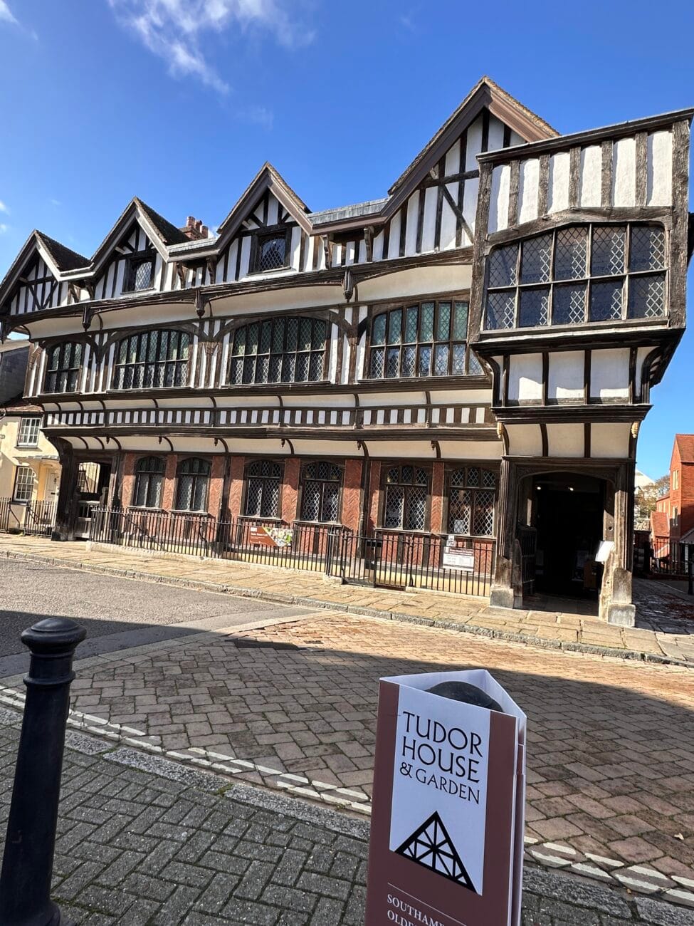 Tudor House exterior with stone base and timber frame